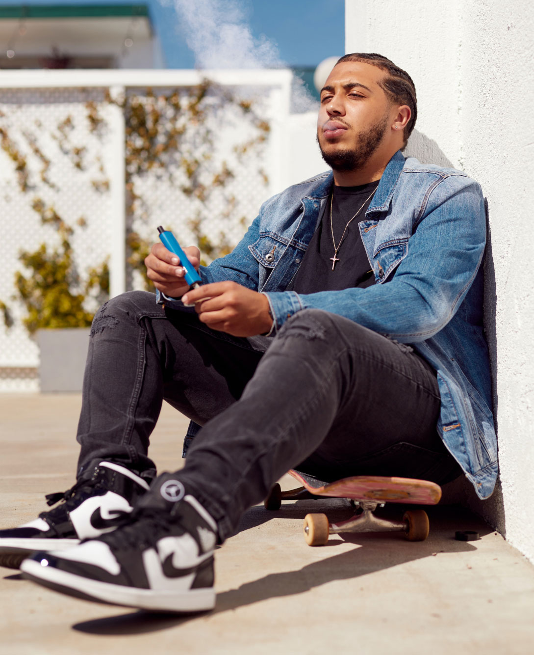 Man Sitting on Skateboards Vaping Customer image 6